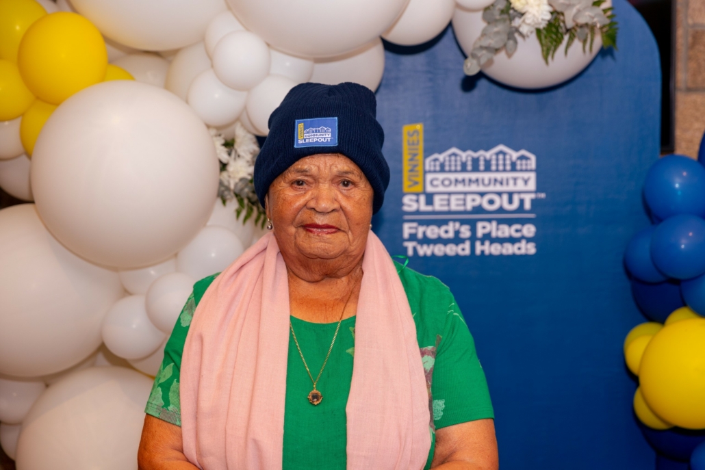 A community member at the Vinnies Community Sleepout backdrop at Fred’s Place, Tweed Heads